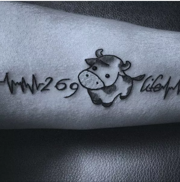 Heartbeat tattoo with 269 and cow