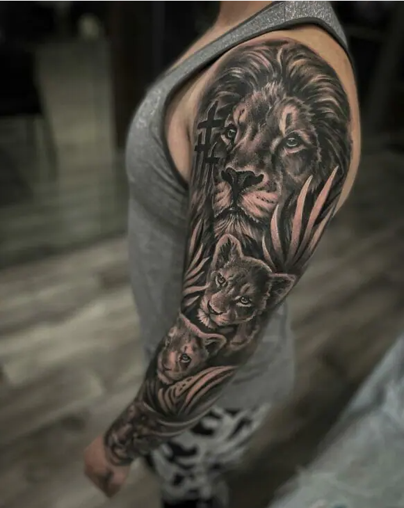 queen lioness and cub tattoo with black ink